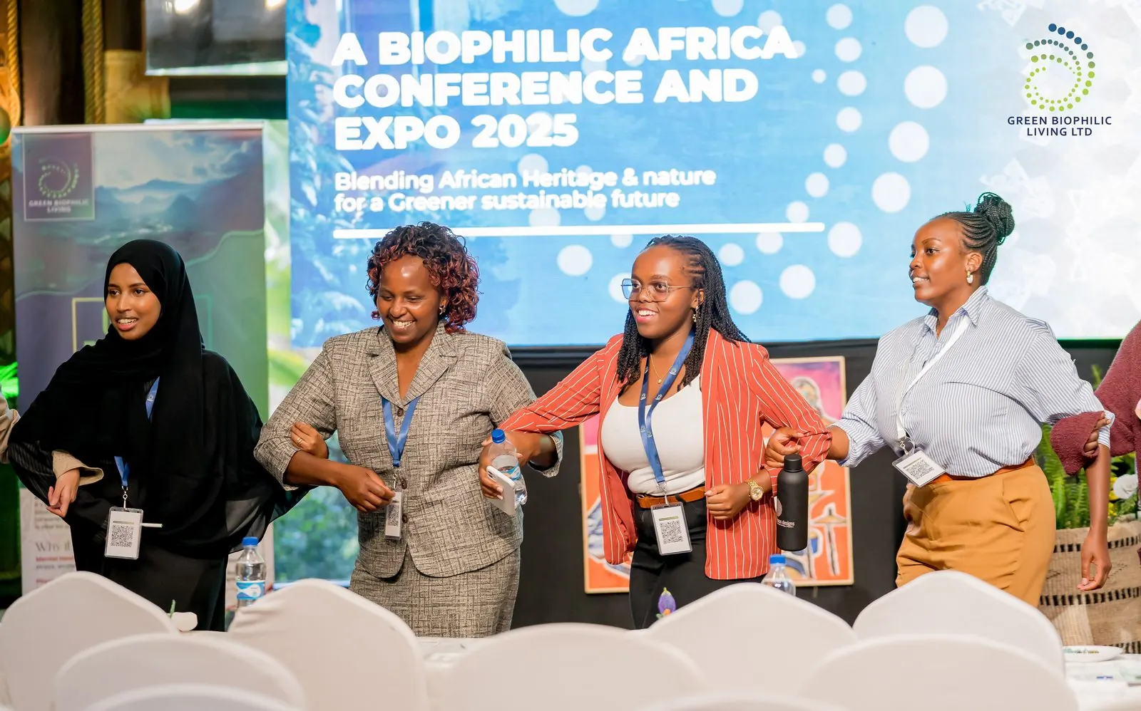 2025 conference — delegates by the conference banner