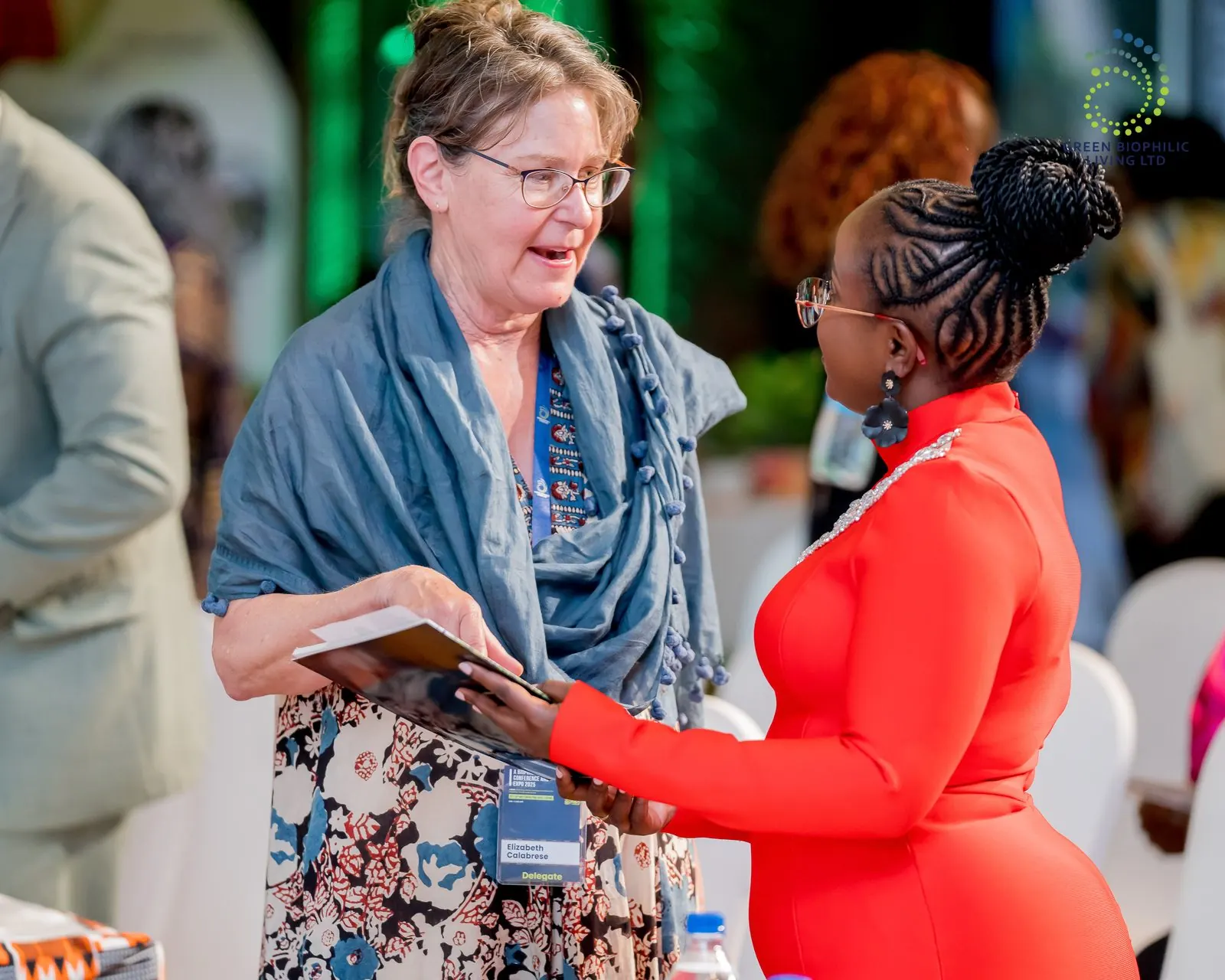 Wangui greeting Elizabeth Calabrese